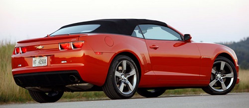 newer model Chevrolet Camaro convertible with a black top