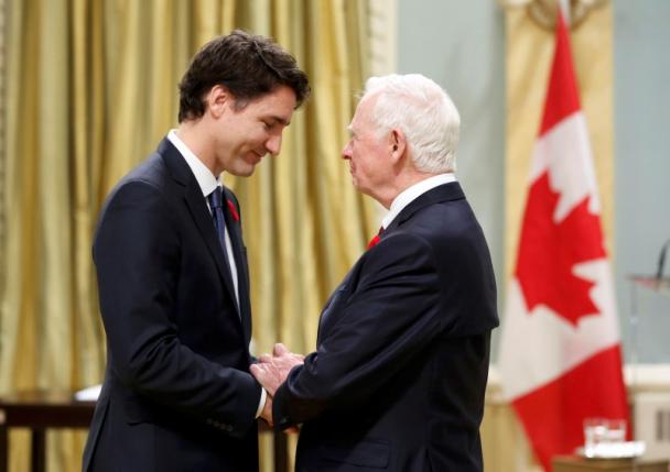 Justin Trudeau is greeted by Governor General David Johnston before being sworn-in as Canada's 23rd prime minister during a ceremony at Rideau Hall in Ottawa November 4, 2015. REUTERS/Chris Wattie